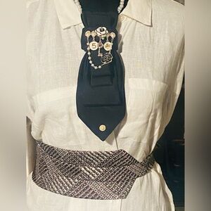 Elegant Black Brooch with Gold Accents